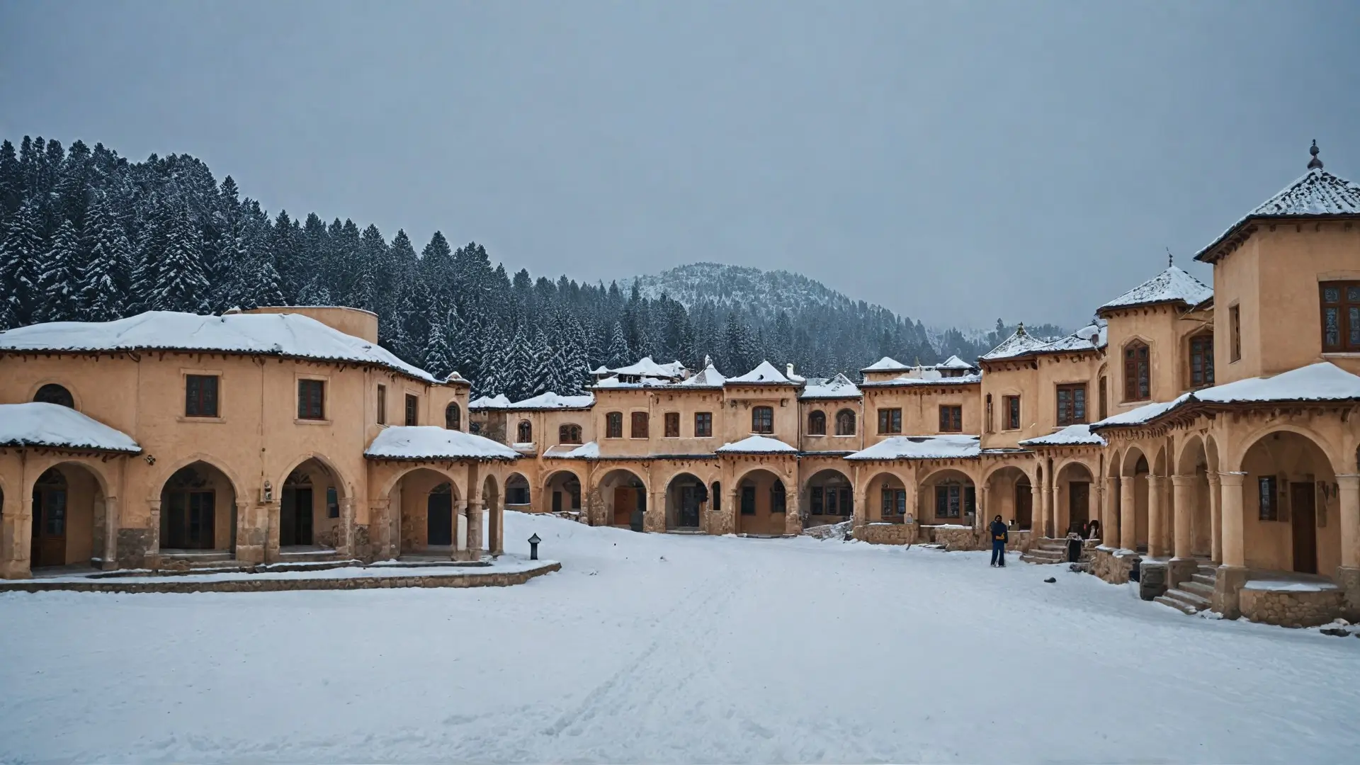 A picturesque winter scene in Ifrane, Morocco, showcasing the charming architecture of the town with its European-inspired buildings. Snow blankets the rooftops and streets, while evergreen trees surround the area. The sky is a clear blue, contrasting with the white snow, and a few people are enjoying outdoor activities like skiing or building snowmen. Capture the serene beauty and unique blend of cultures in this Moroccan alpine town.